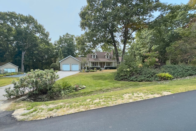 cape cod home with a front yard