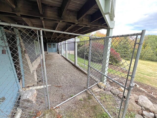 exterior space featuring a carport and an outdoor structure