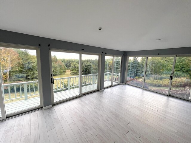 unfurnished living room featuring wood finished floors