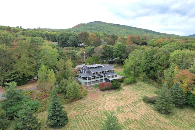 bird's eye view featuring a wooded view and a mountain view