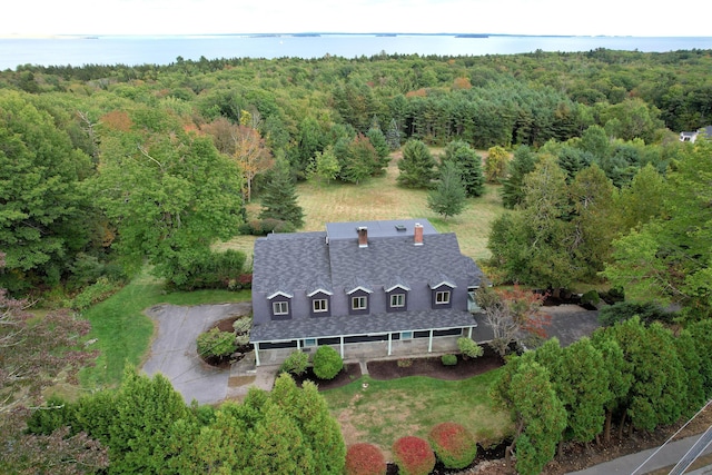 bird's eye view with a water view and a view of trees