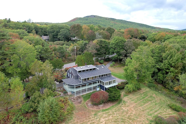 bird's eye view featuring a wooded view
