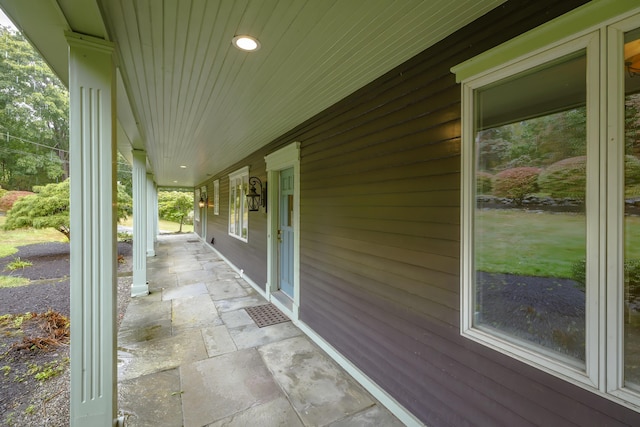 view of patio featuring a porch