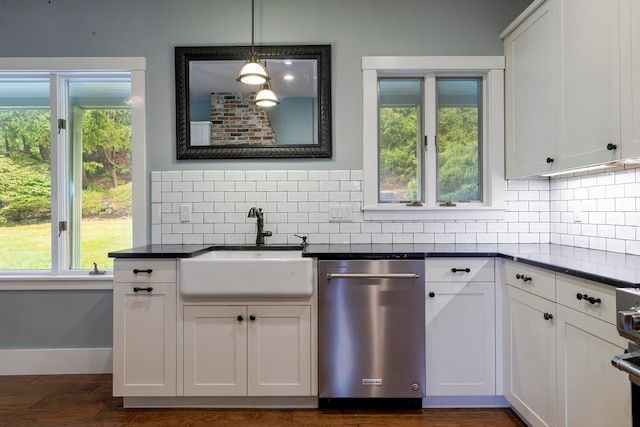 kitchen featuring stainless steel dishwasher, white cabinetry, and sink