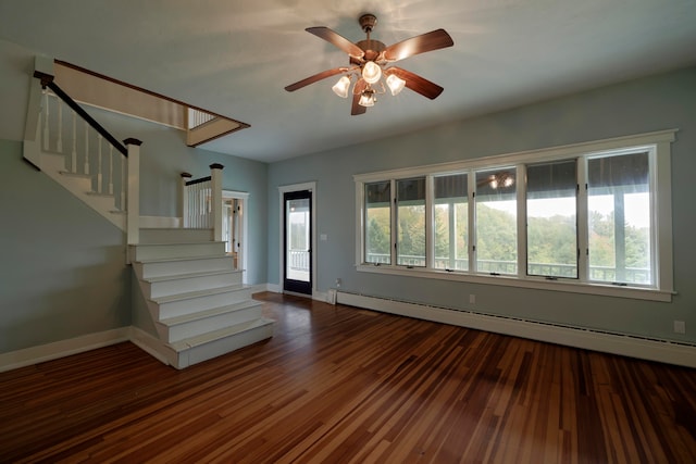 interior space featuring a baseboard heating unit, dark hardwood / wood-style floors, and plenty of natural light