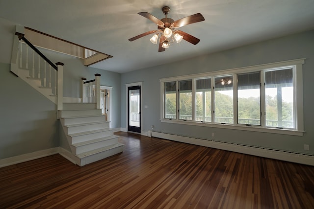 interior space featuring stairs, a baseboard radiator, wood finished floors, and a healthy amount of sunlight