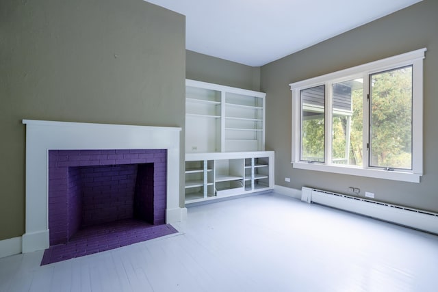 unfurnished living room featuring baseboard heating, wood finished floors, and a fireplace with flush hearth