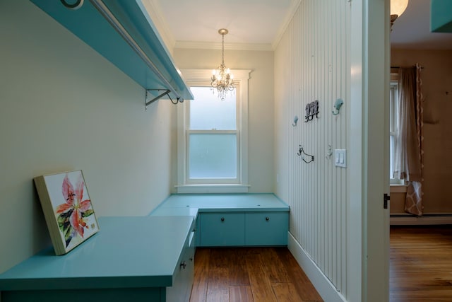 interior space with ornamental molding, baseboard heating, an inviting chandelier, and dark hardwood / wood-style flooring