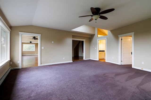 unfurnished room featuring lofted ceiling, dark carpet, a baseboard heating unit, and ceiling fan