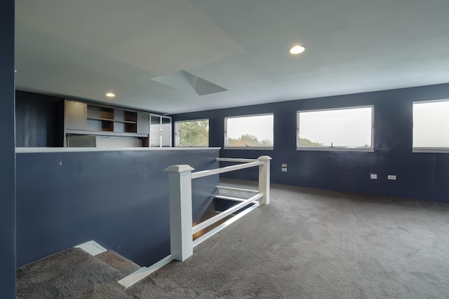stairs with recessed lighting and carpet flooring