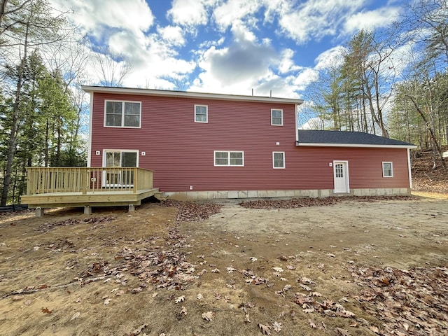 back of house with a wooden deck