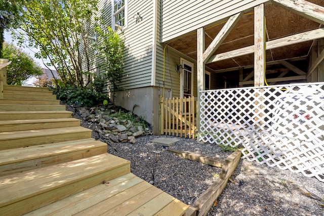 view of home's exterior featuring stairs