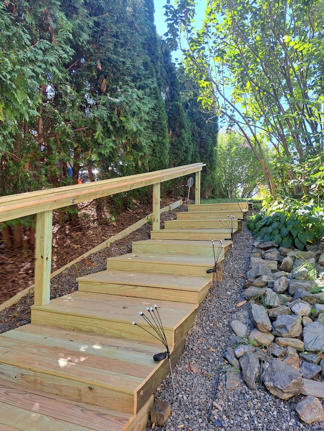 wooden deck featuring stairs