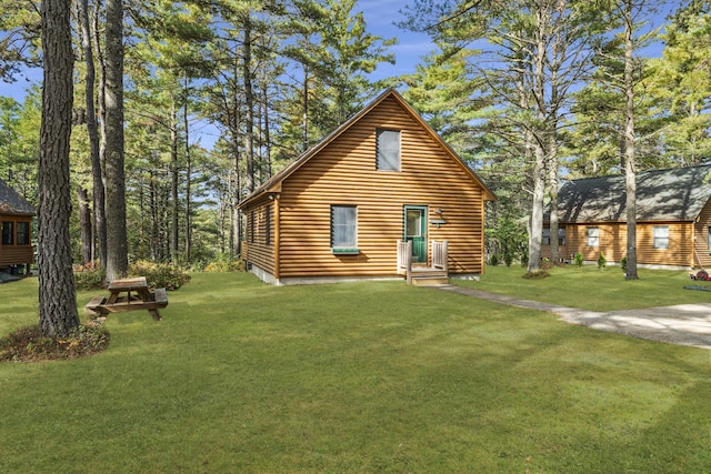 rear view of house with a lawn