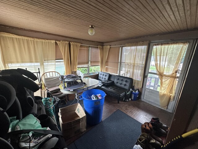 sunroom featuring wooden ceiling