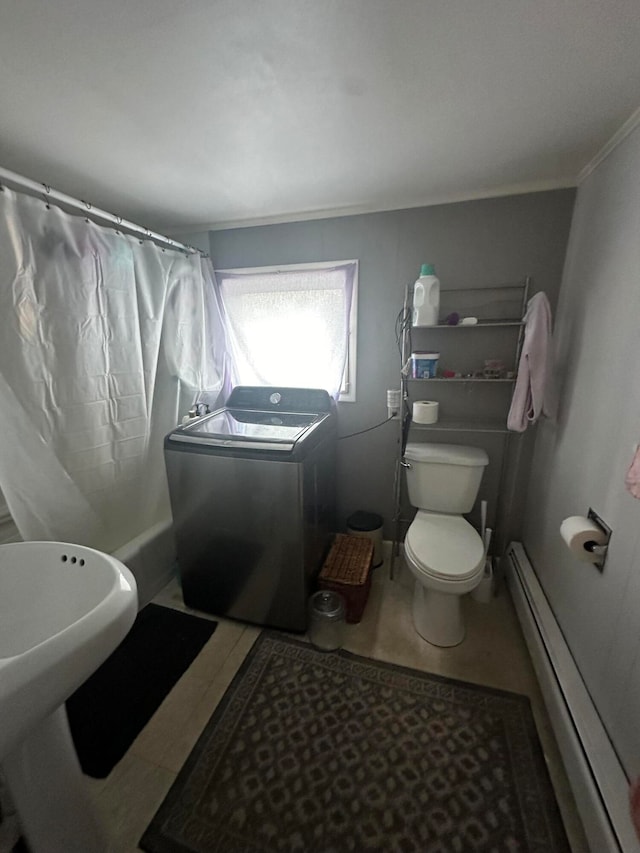 bathroom featuring baseboard heating, washer / clothes dryer, a shower with curtain, crown molding, and toilet