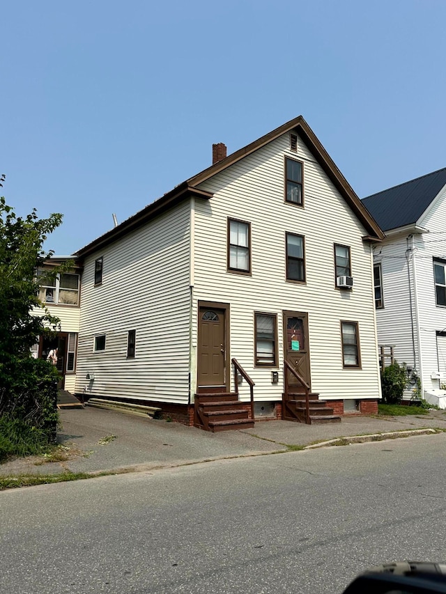 view of front of house featuring cooling unit