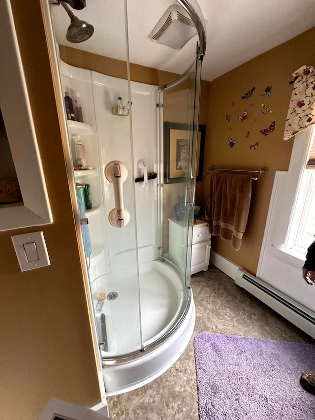 bathroom with walk in shower and a baseboard radiator