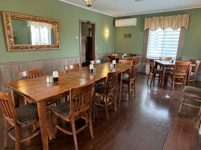 dining room featuring dark hardwood / wood-style floors and an AC wall unit