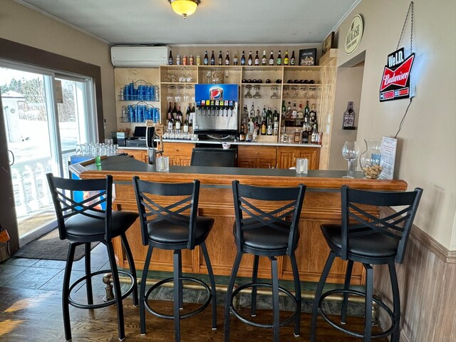 bar featuring ornamental molding, black range, and a wall mounted AC