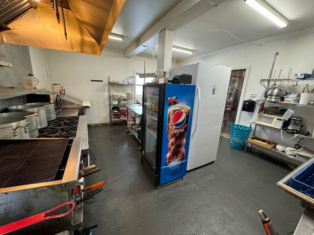 interior space featuring white refrigerator and a workshop area