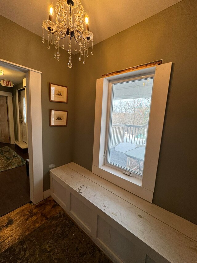 mudroom featuring a notable chandelier