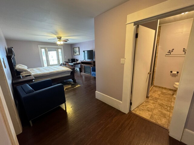 interior space with ceiling fan and hardwood / wood-style flooring