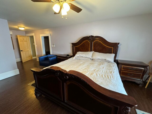 bedroom with dark hardwood / wood-style floors and ceiling fan