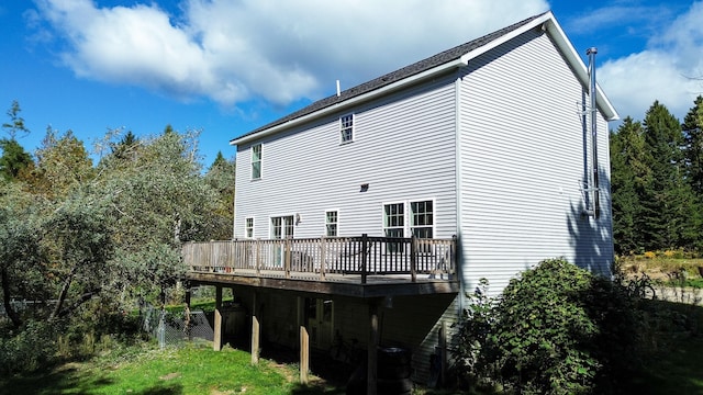 back of property featuring a wooden deck