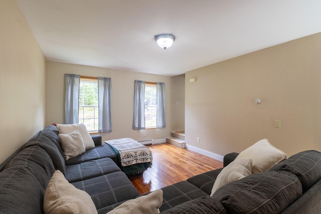 living room with light hardwood / wood-style floors and a baseboard radiator