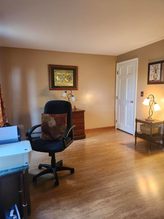 office space with light hardwood / wood-style flooring