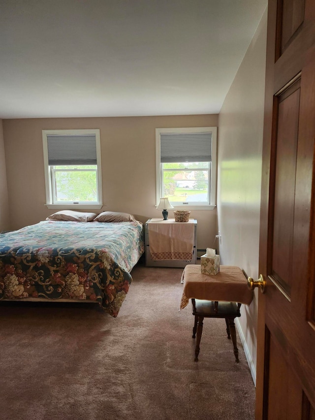 carpeted bedroom featuring lofted ceiling