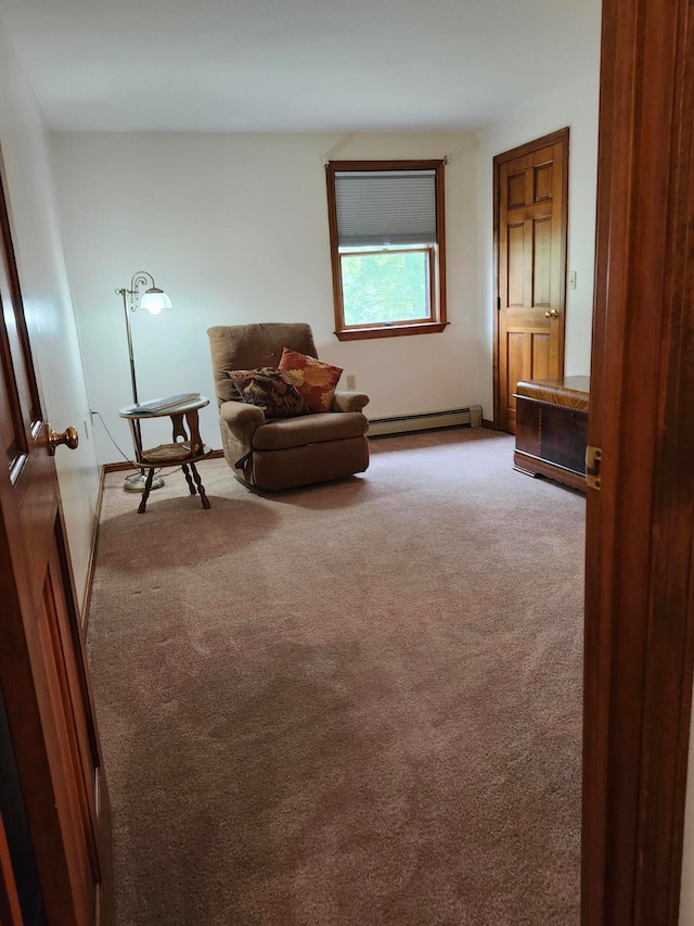 unfurnished room with a baseboard radiator and light colored carpet