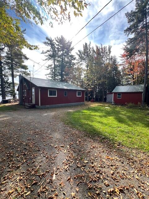 view of property exterior featuring a yard