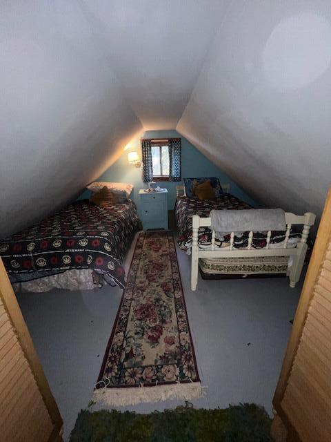 bedroom with vaulted ceiling