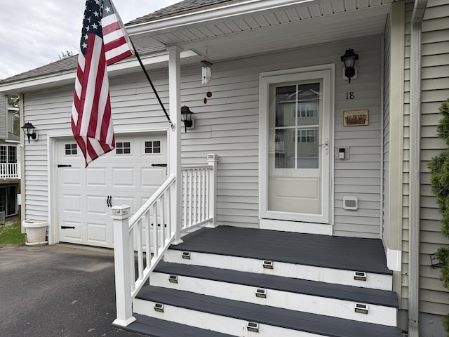 18 Ledges Ct Unit 18, Lewiston, ME 04240 - property entrance featuring a garage and asphalt driveway