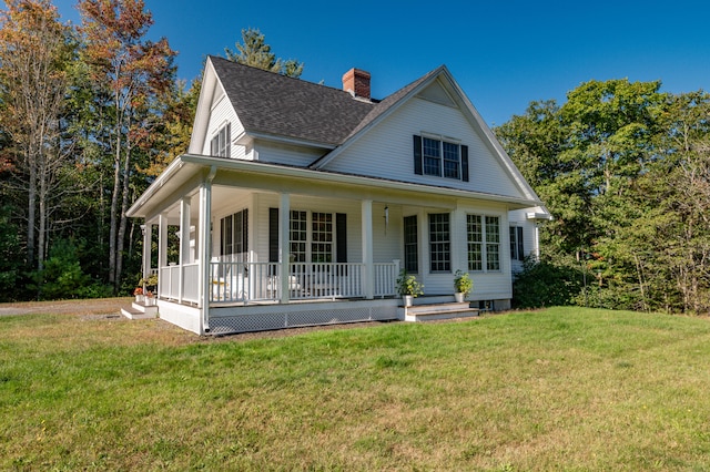 farmhouse-style home featuring a front yard and a porch