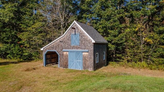 view of outdoor structure with a lawn