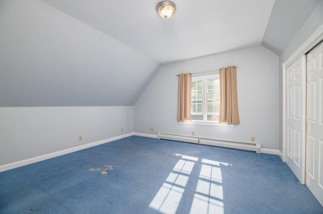 bonus room with a baseboard radiator, vaulted ceiling, and carpet floors