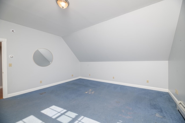 bonus room with vaulted ceiling, baseboard heating, and dark carpet