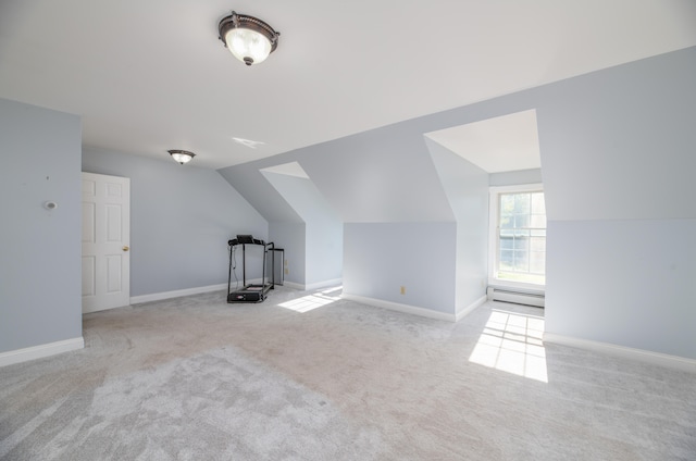 bonus room featuring light colored carpet, a baseboard radiator, and lofted ceiling