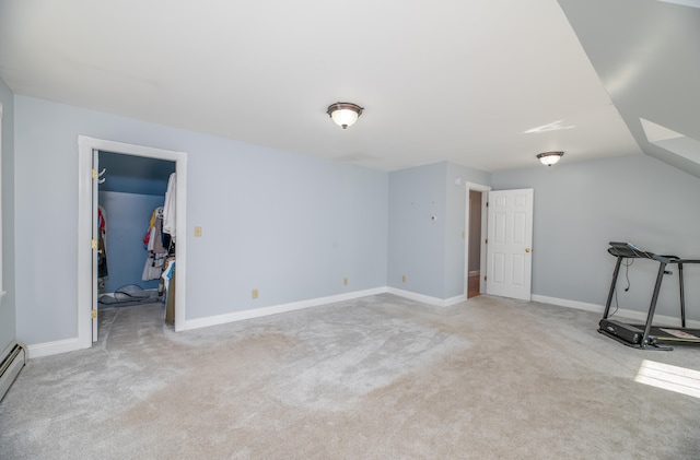 bonus room featuring light carpet, a baseboard heating unit, and vaulted ceiling