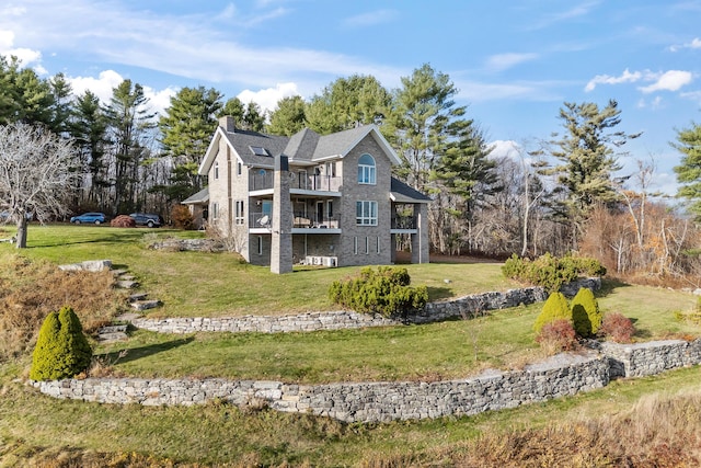 96 Bunker Hill Rd, Newcastle, ME 04553 - rear view of house with a balcony, a chimney, a yard, and brick siding