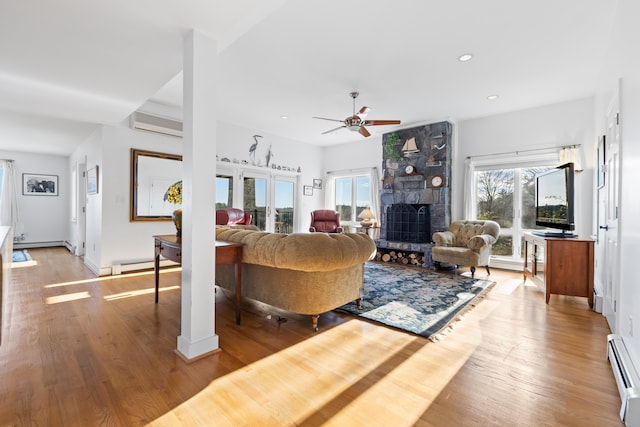 96 Bunker Hill Rd, Newcastle, ME 04553 - living area featuring a baseboard heating unit, a ceiling fan, a fireplace, light wood-style flooring, and recessed lighting