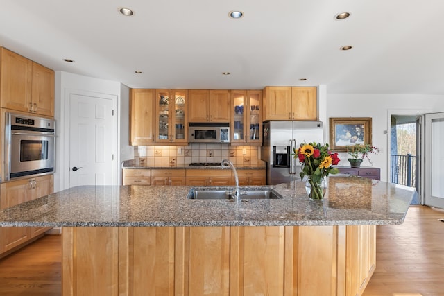 96 Bunker Hill Rd, Newcastle, ME 04553 - kitchen featuring appliances with stainless steel finishes, a sink, a center island with sink, recessed lighting, and tasteful backsplash
