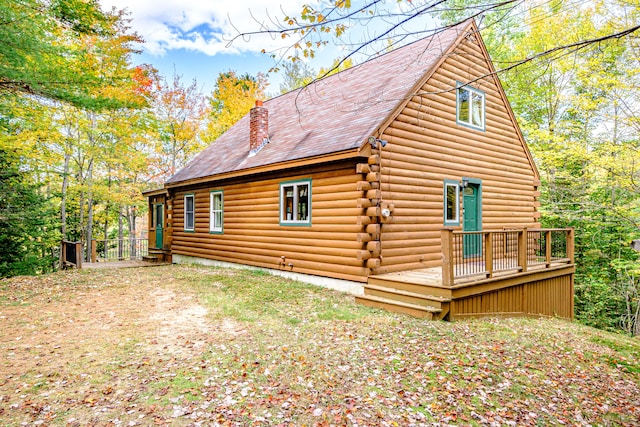 rear view of house with a wooden deck