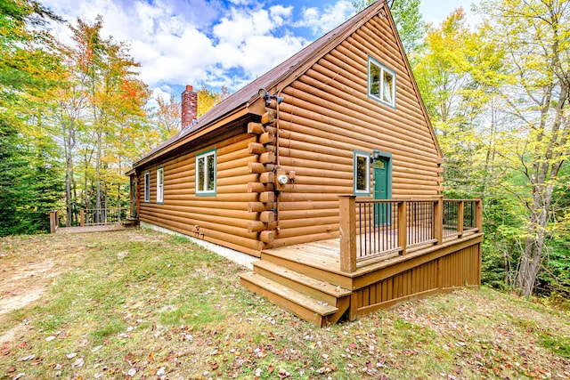 11 Goss Pond Rd, Bethel, ME 04217 - view of home's exterior with log exterior, a chimney, and a deck