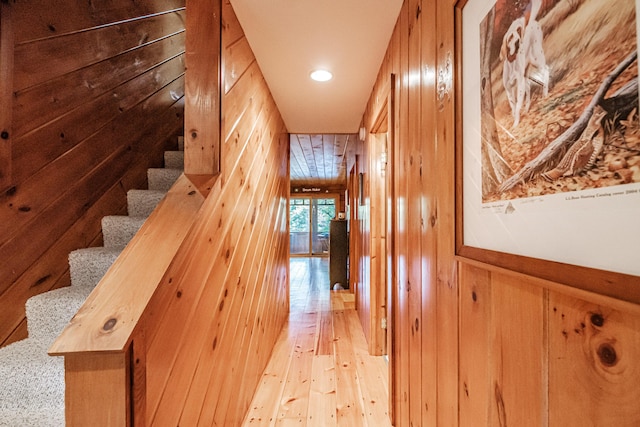 11 Goss Pond Rd, Bethel, ME 04217 - corridor with wooden walls, light wood-style flooring, stairway, and recessed lighting