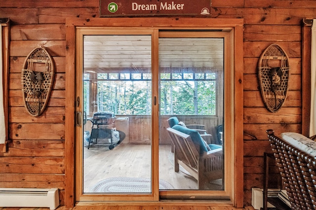 11 Goss Pond Rd, Bethel, ME 04217 - doorway featuring baseboard heating, healthy amount of natural light, and wood finished floors