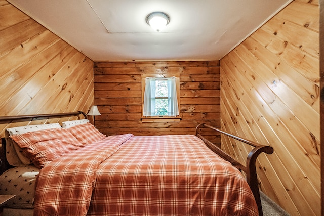 unfurnished bedroom featuring wooden walls